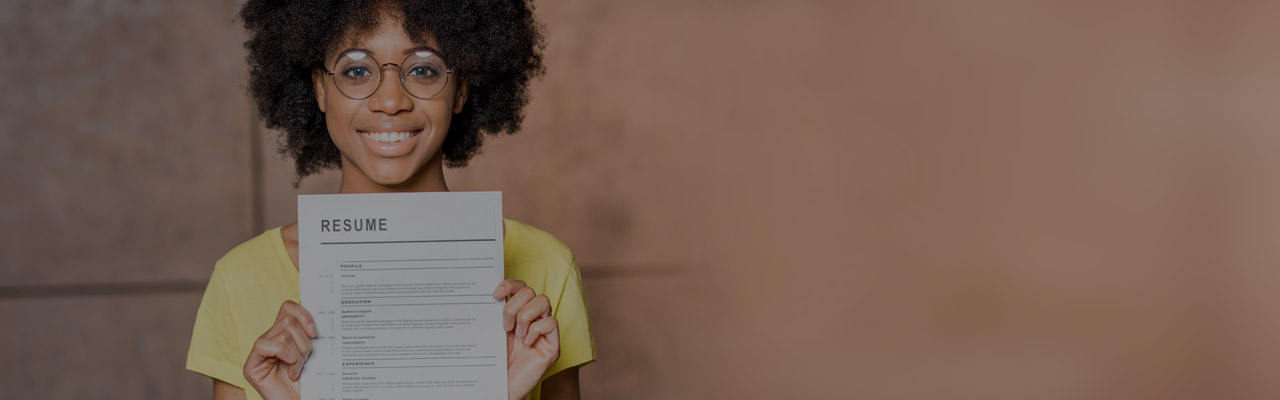 Woman holding up a resume